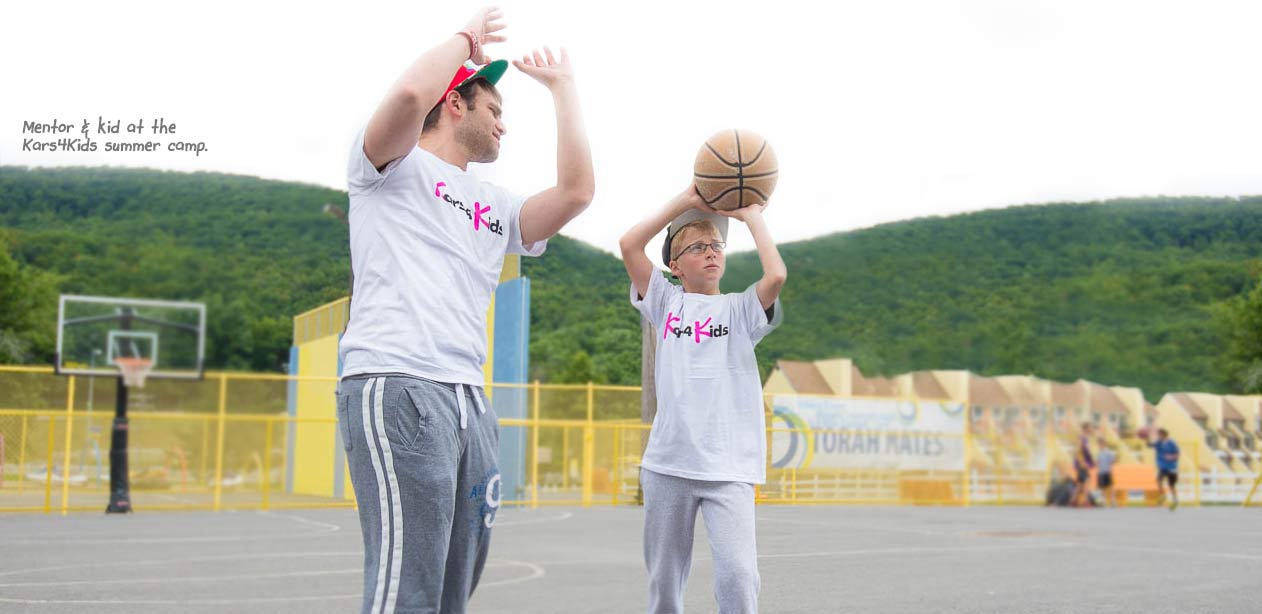 Mentor and kid at the Kars4Kids summer camp