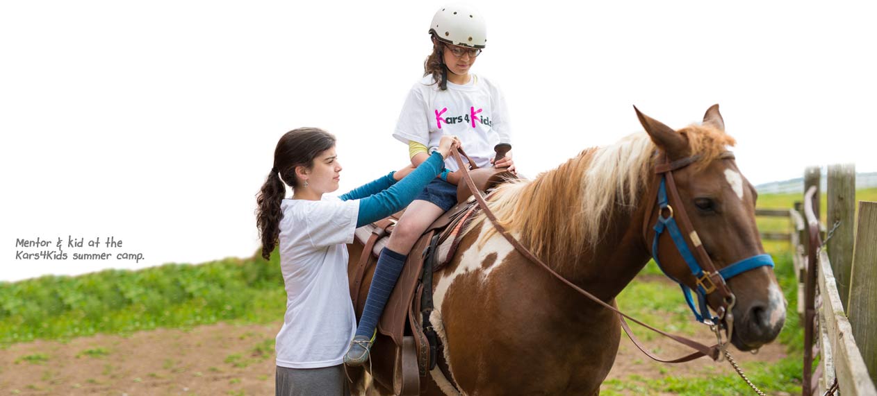 Mentor and kid at the Kars4Kids summer camp